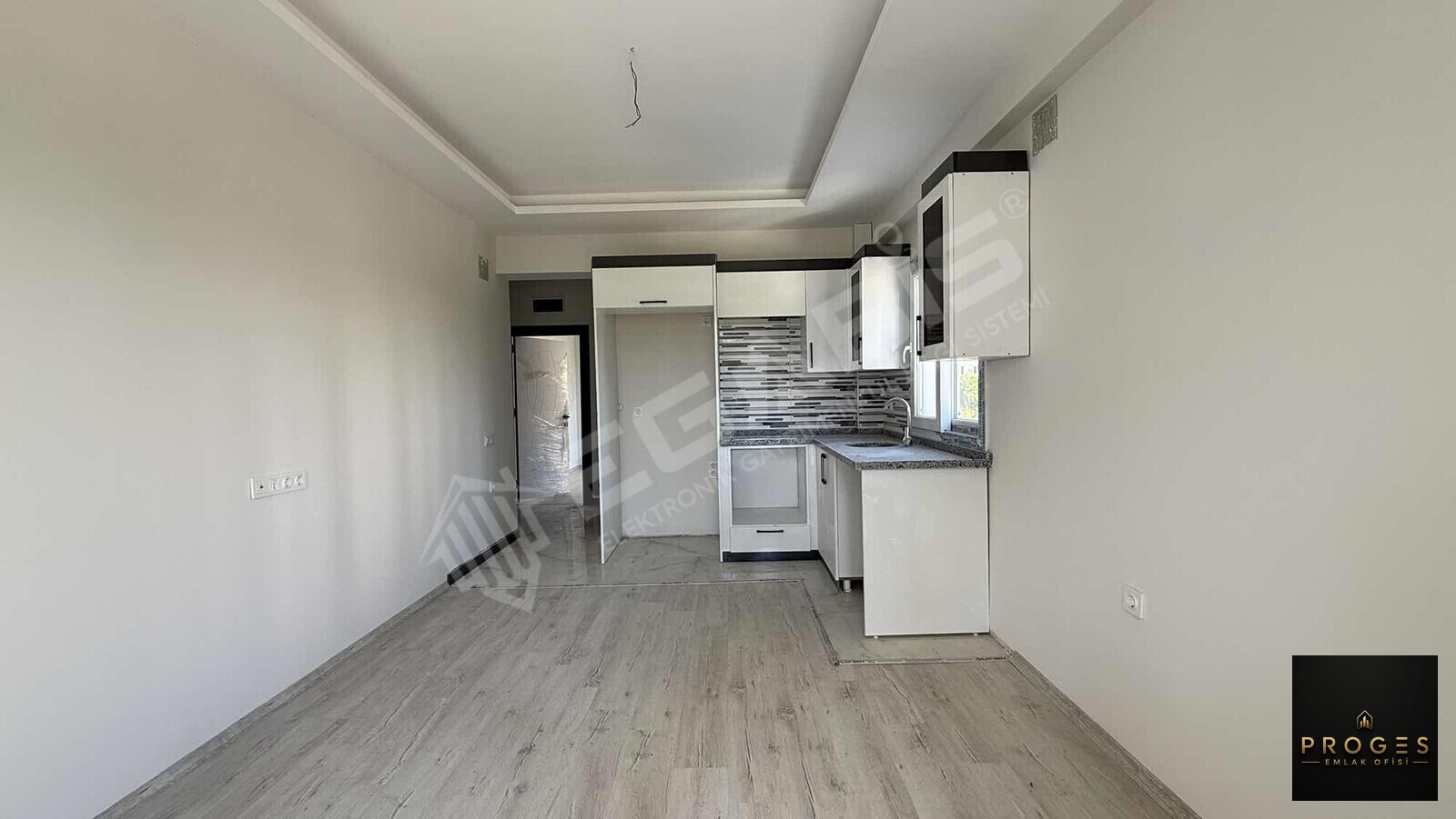 PROGES'TEN ARPAÇBAHŞİŞ'TE DENİZE YÜRÜME MESAFESİNDE 1+1 SATILIK - 2