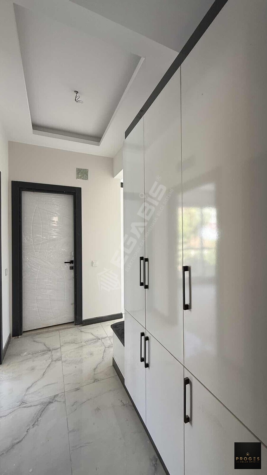 PROGES'TEN ARPAÇBAHŞİŞ'TE DENİZE YÜRÜME MESAFESİNDE 1+1 SATILIK - 24